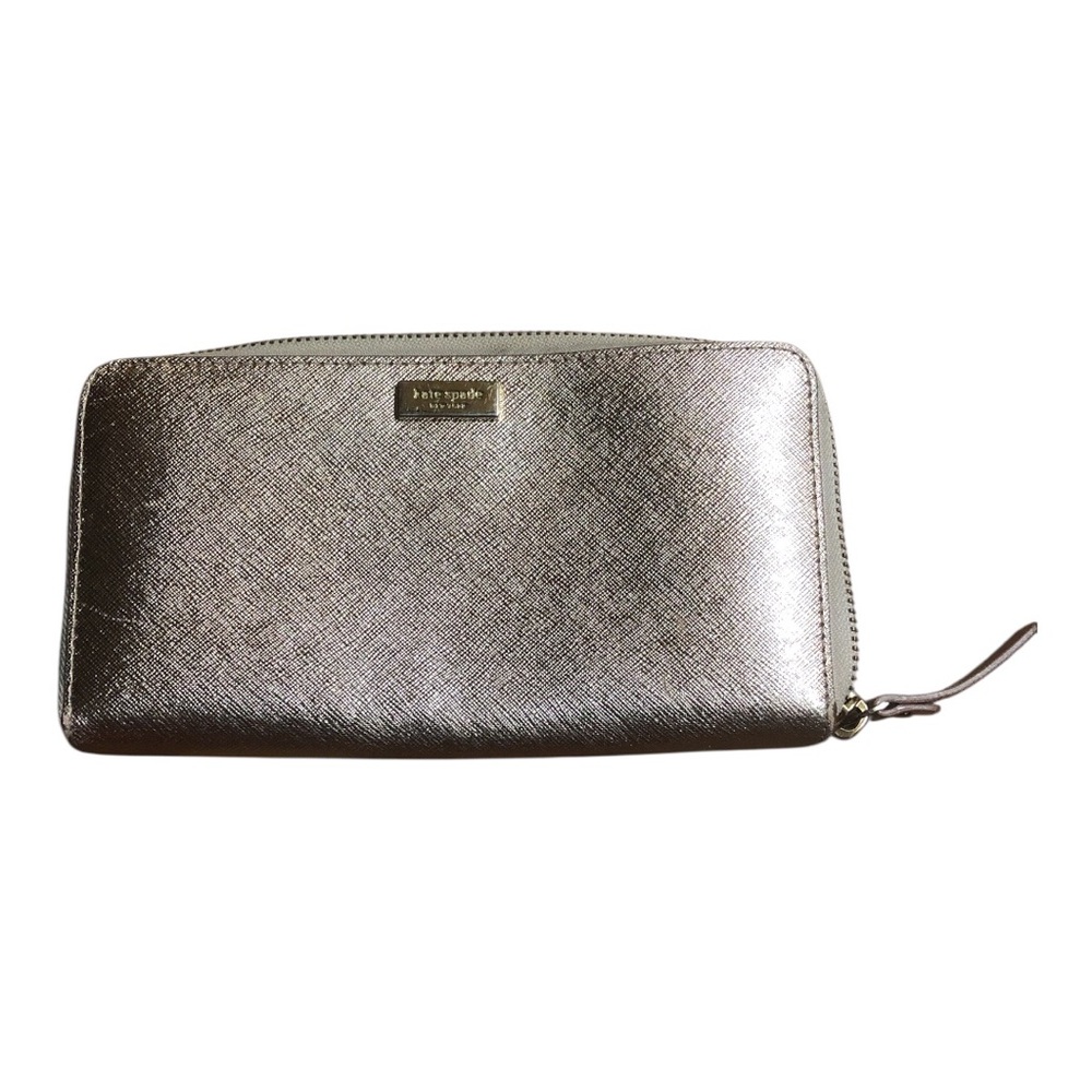kate spade metallic silver zip-around wallet with gold logo
